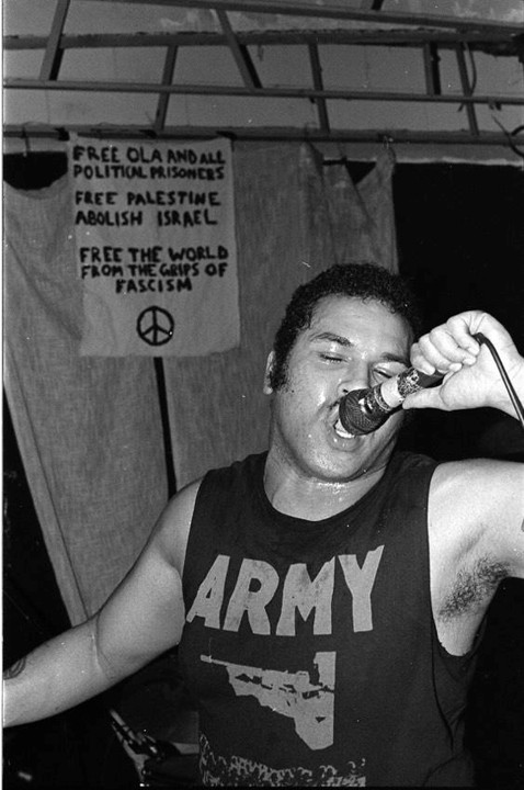 Bobby Cole singing into a microphone.